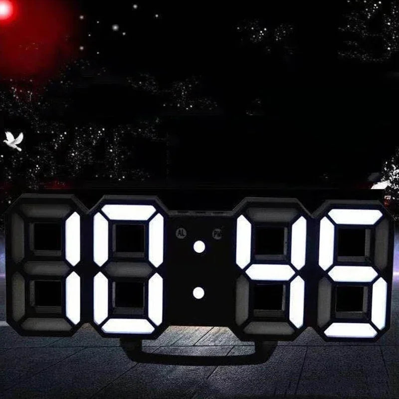 Modern black digital alarm clock with large, bright white LED display showing the time on a desk stand.