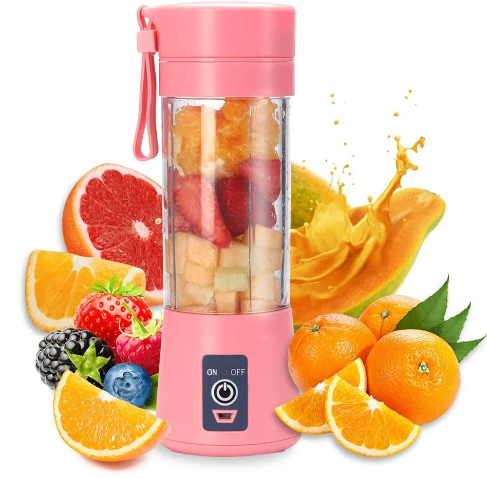 A portable, pink handheld blender bottle filled with sliced fruit, surrounded by fresh citrus, berries, and splashes.
