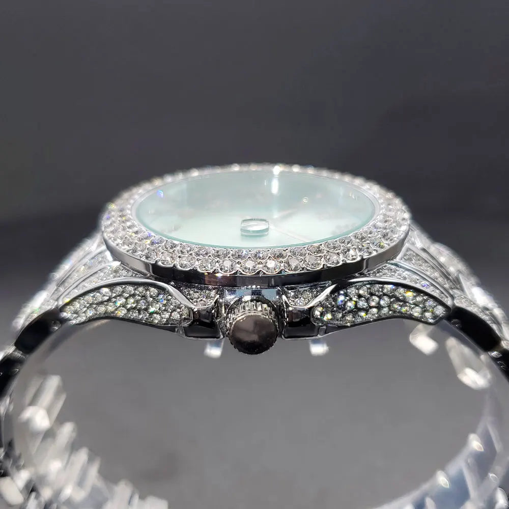 Side profile of an elegant silver-tone women’s dress watch with a crystal-encrusted bezel and strap.