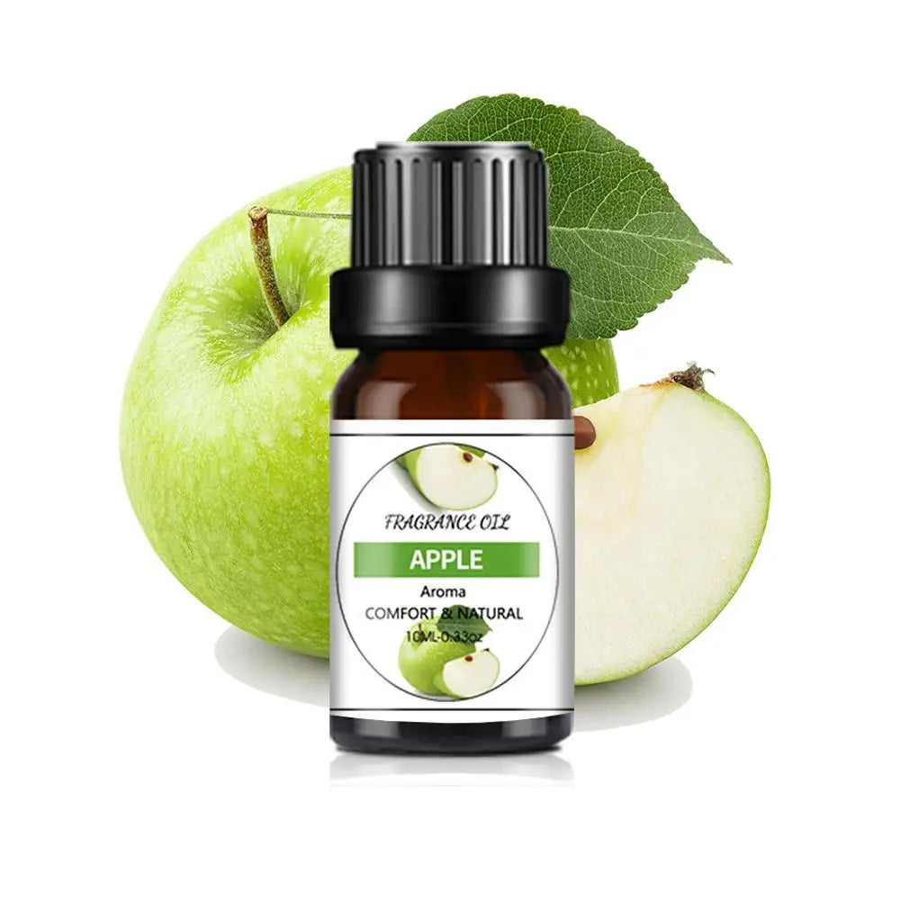 10ml bottle of apple fragrance oil with a dark dropper cap, displayed in front of fresh green apples.