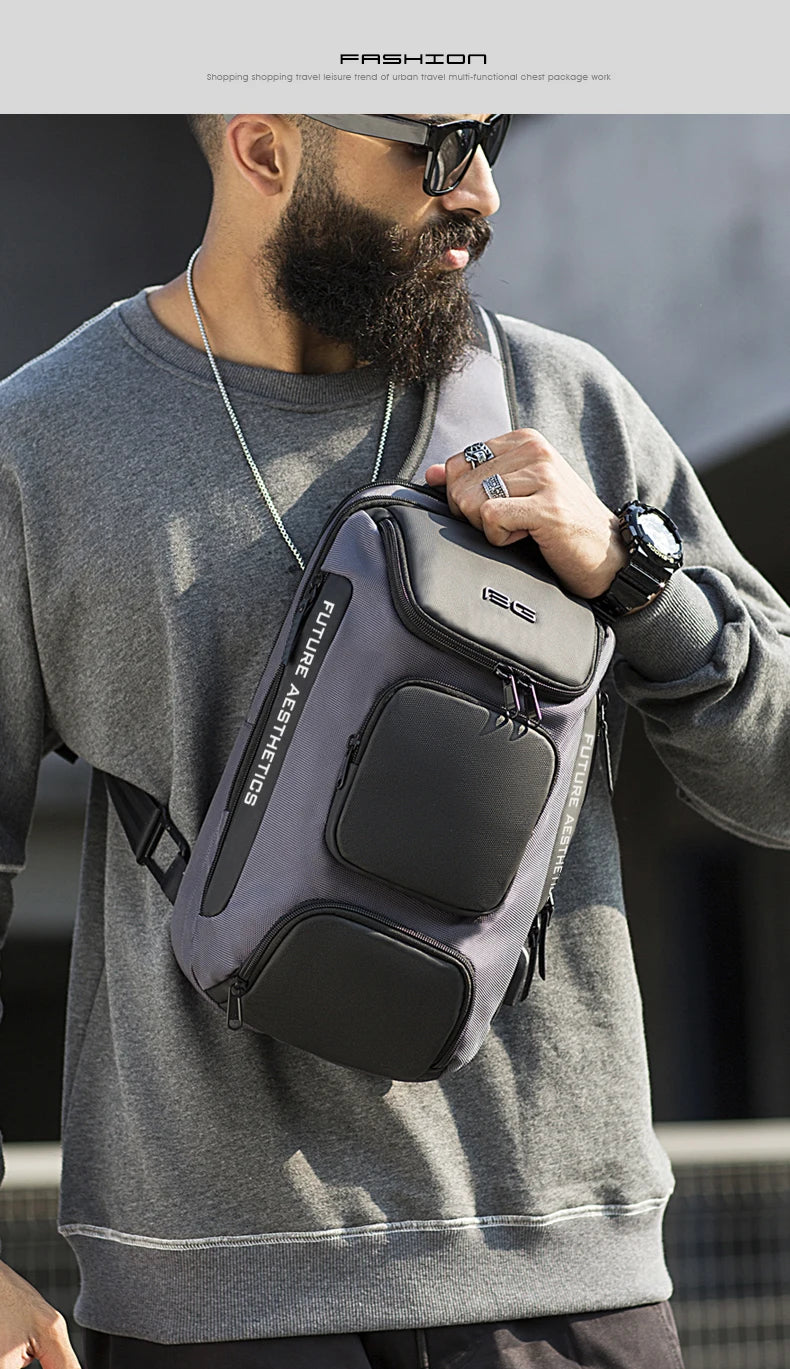 A man wearing a grey and black multi-pocket crossbody bag with "FUTURE AESTHETICS" printed on the side.