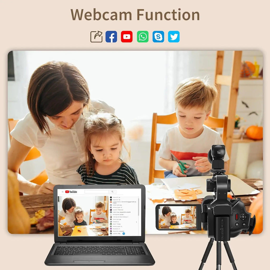 Black plastic digital video camera on a tripod, connected to a laptop to show a live webcam feed of two children.