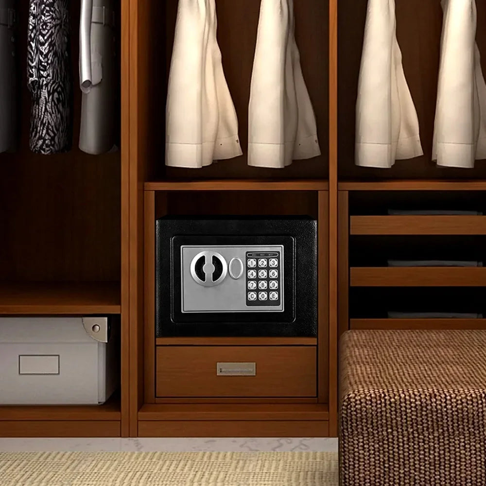 Black metal security safe with a silver electronic keypad and handle, installed inside a wooden closet shelf.