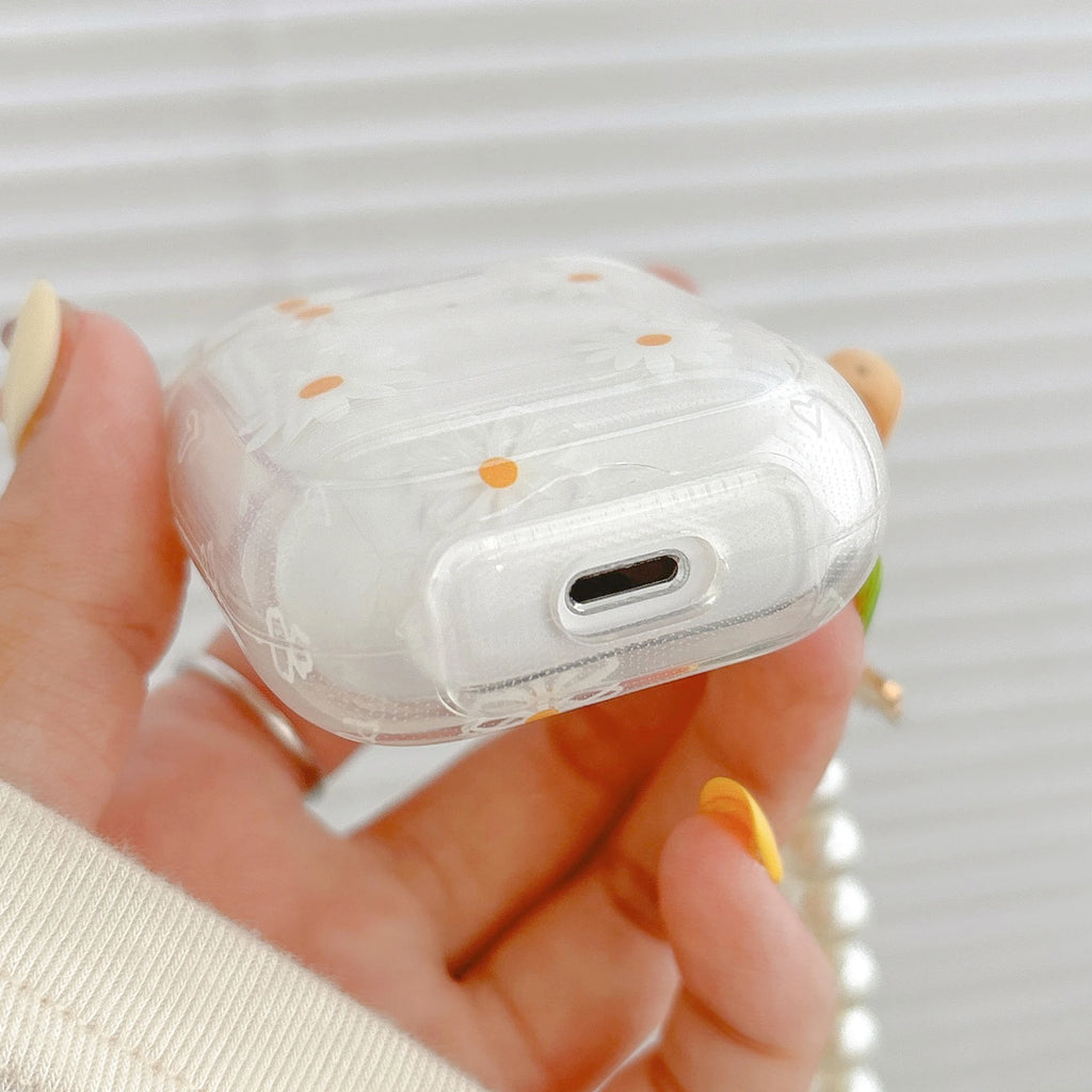Clear, protective AirPod case featuring a daisy floral pattern, designed for Apple AirPods.