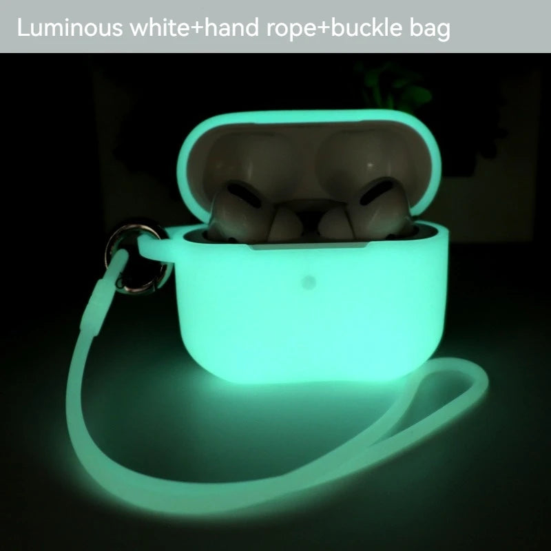 Luminous glow-in-the-dark silicone AirPods Pro case in white, featuring a detachable wrist strap and metal buckle.
