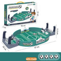 Tabletop football game set featuring a green pitch, two manual player controls, digital scoreboard, and four mini balls.