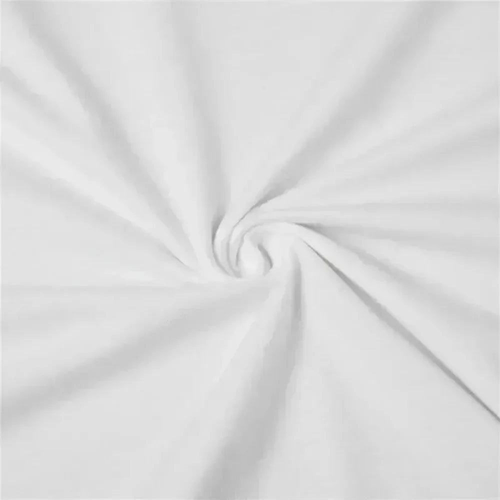 Close-up of soft, plain white fabric with gentle swirls and natural folds.
