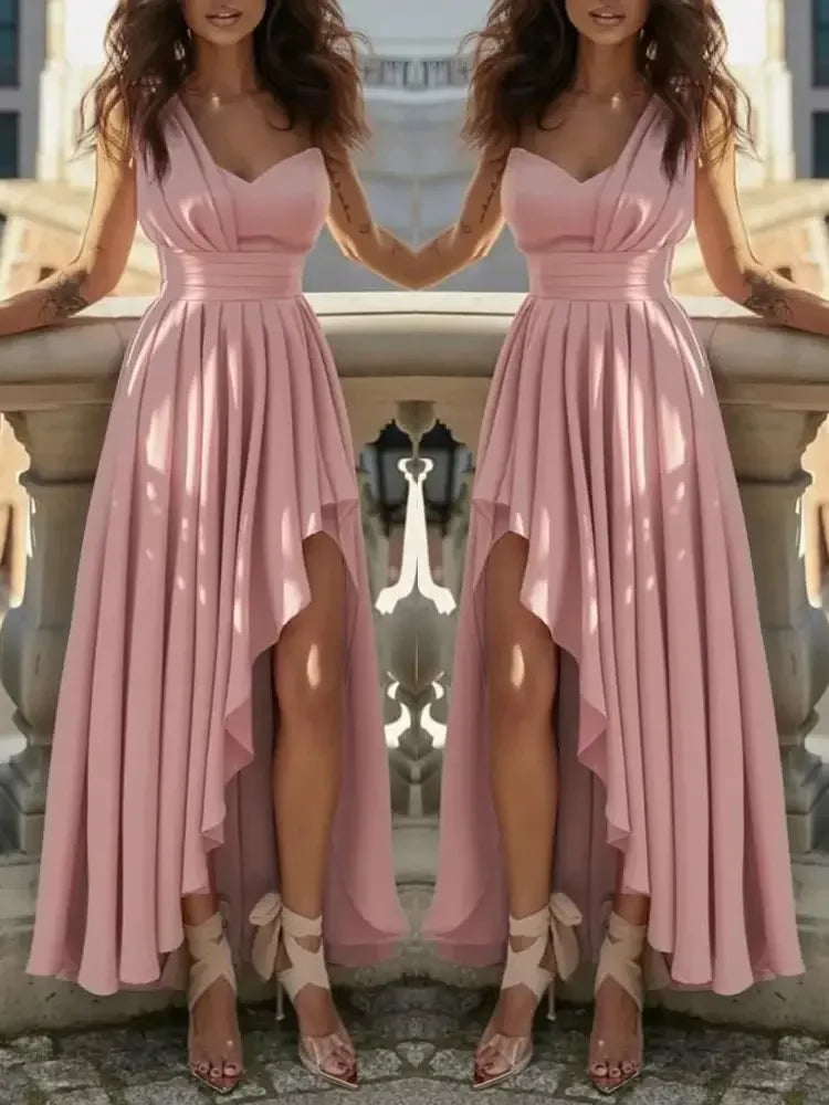 Elegant dusty pink maxi dress with a one-shoulder bodice, cinched waist, and a dramatic high-low ruffled skirt.