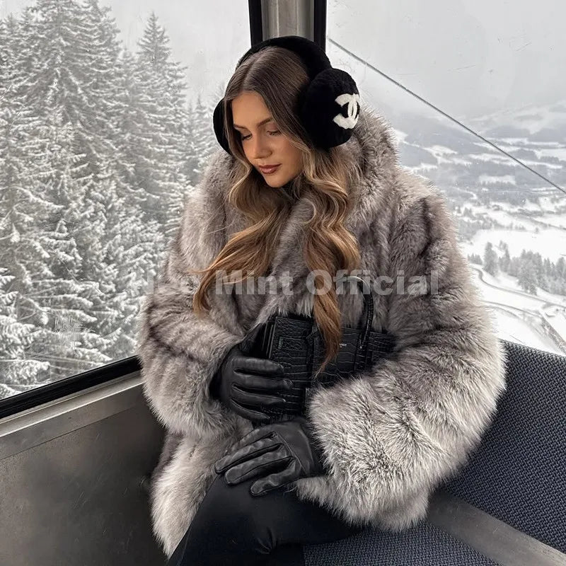 Brown striped faux fur coat with a large scarf collar and fluffy texture worn by a woman.