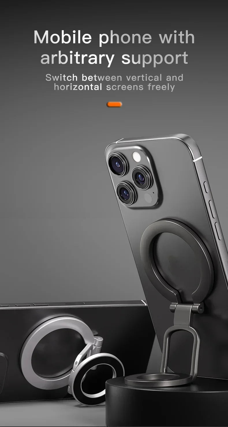 Dark grey smartphone with a foldable, circular metal ring stand on the back for vertical and horizontal support.