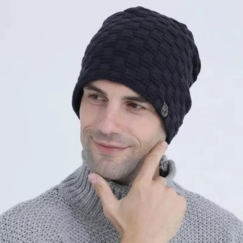 Man wearing a black, basket-weave textured beanie hat with a warm, plush-lined interior for winter.