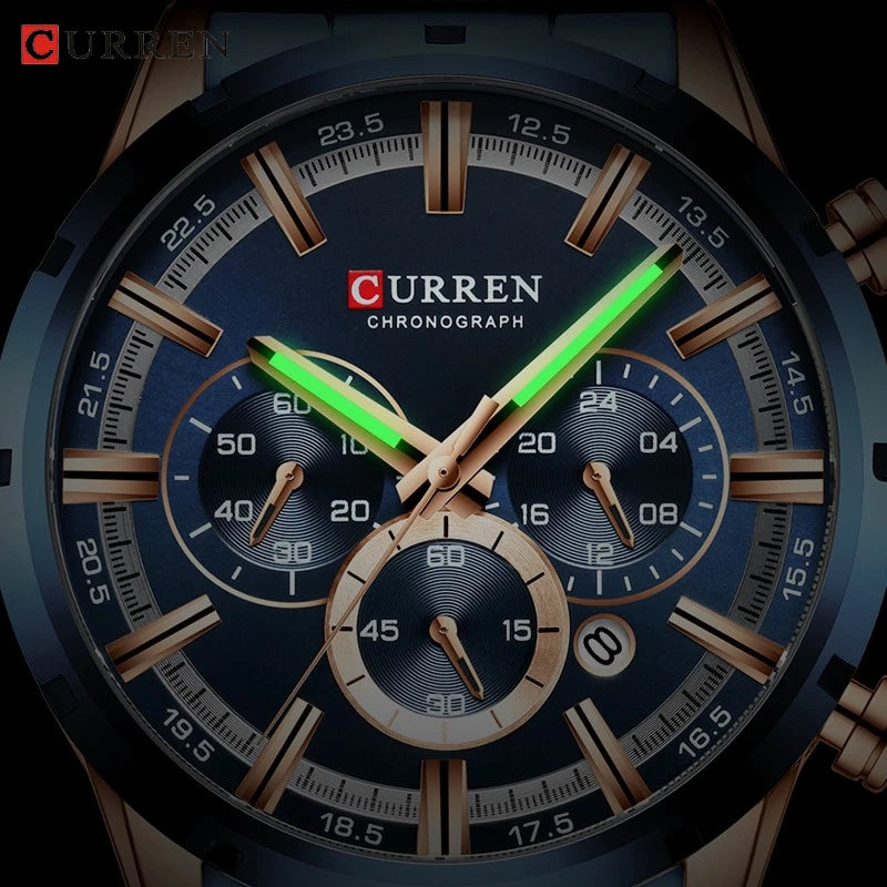 Curren blue chronograph wristwatch with rose gold markers, three sub-dials, and glowing green hands.