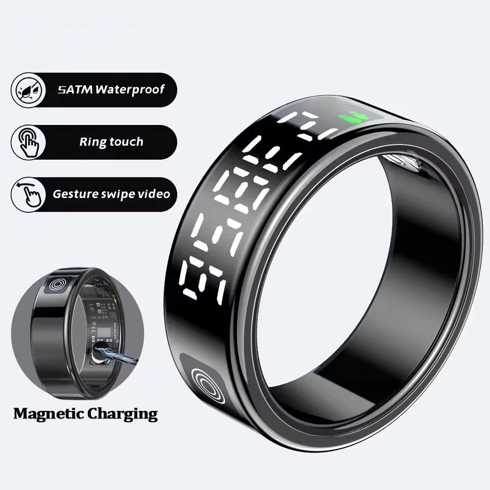 Glossy black smart health tracking ring with digital display, touch control, gesture features, and magnetic charging.