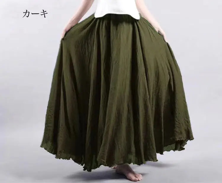 Olive green high-waisted maxi skirt with a full, flowing silhouette and a soft, gathered fabric texture.