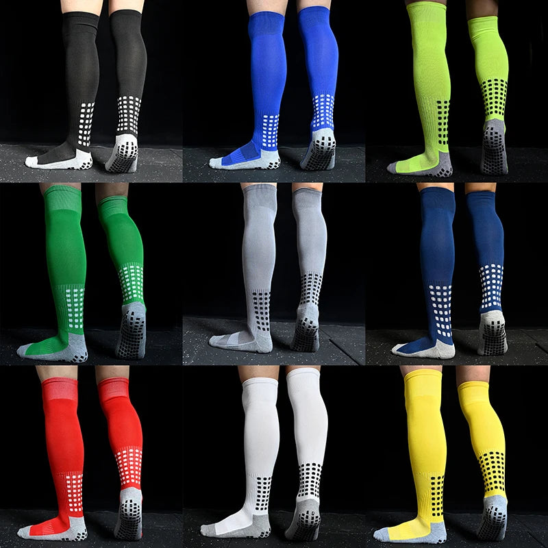 A grid of nine pairs of multi-coloured sports socks featuring grip-dotted soles for traction.