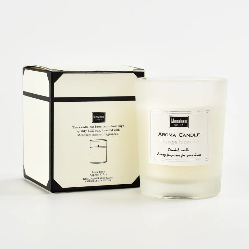 Orange blossom scented candle in a minimalist frosted glass jar with its matching cream and black presentation box.