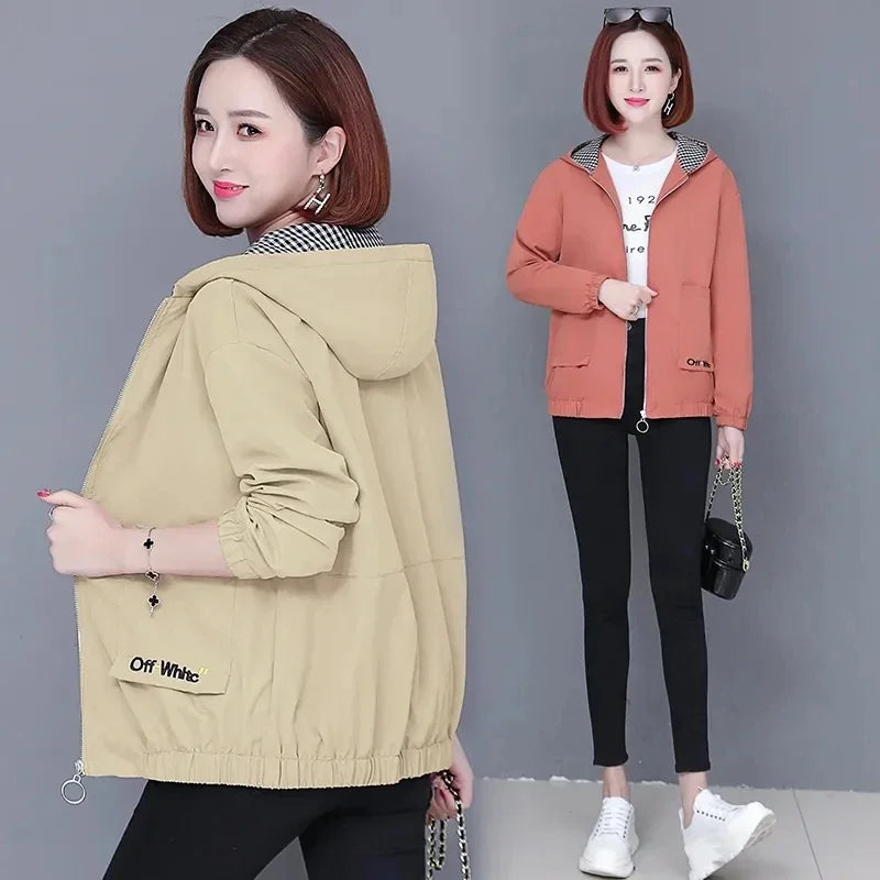 Women’s zip-up hooded jacket in beige or coral, featuring a gingham-lined hood, elasticated cuffs, and front pockets.