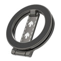 Dark grey circular magnetic phone holder with a hinged kickstand featuring white road-like arrow graphics.