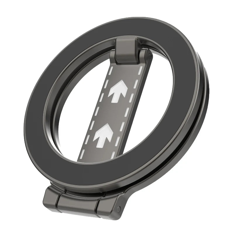 Dark grey circular magnetic phone holder with a hinged kickstand featuring white road-like arrow graphics.