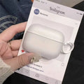 White silicone AirPods Pro case with ring attachment, presented on a social media-themed display card.