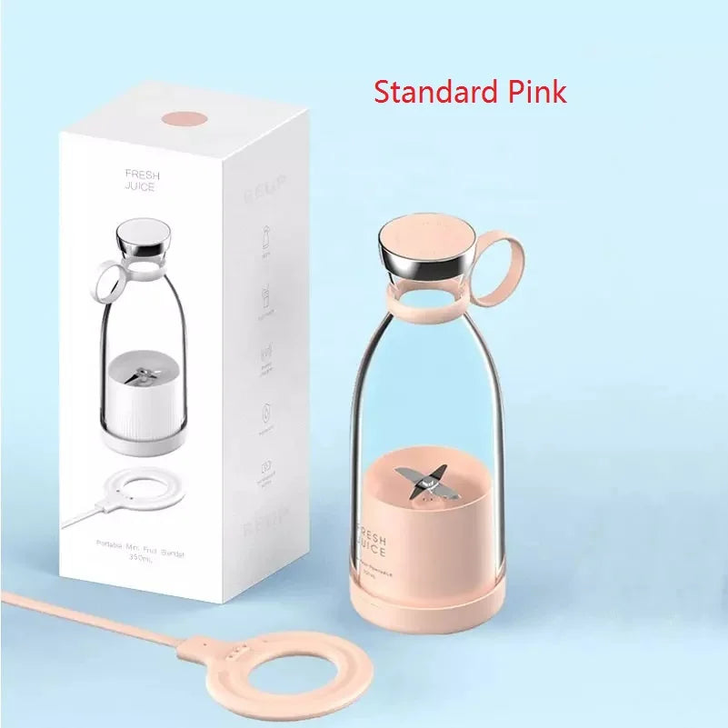 Portable pink personal blender with a minimalist glass design, silver accents, and a matching magnetic charging base.