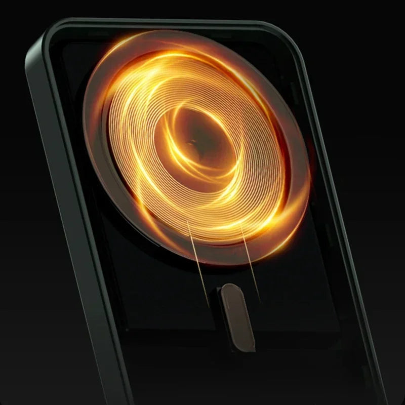 Black magnetic wireless power bank with a glowing orange circular coil design and sleek, minimalist aesthetic.