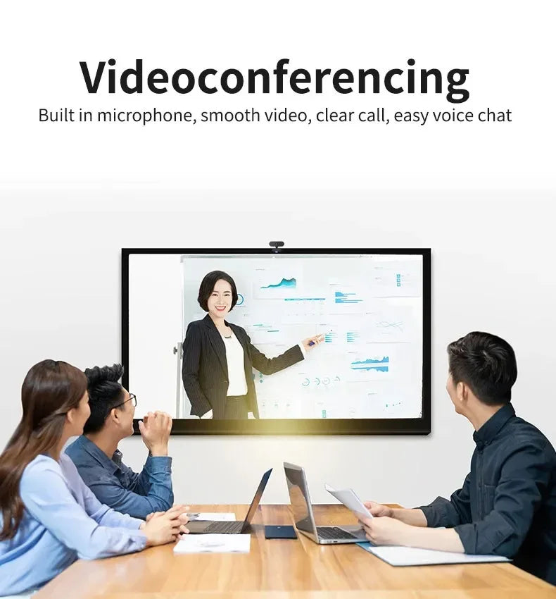 Black 1080p USB webcam mounted on a monitor, displaying a business video conference with a woman presenting charts.