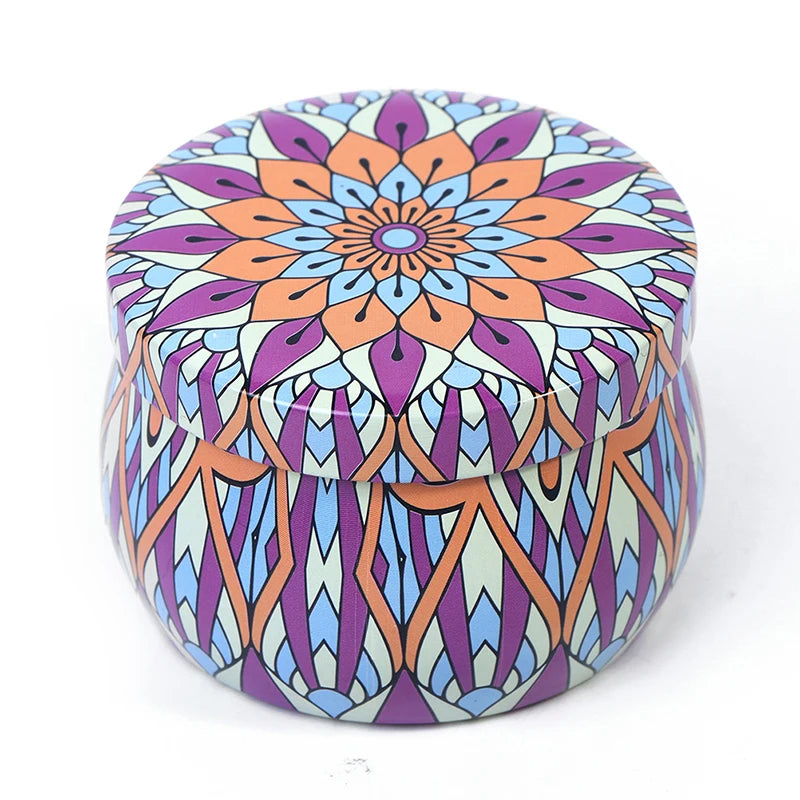 Small round metal storage tin featuring a vibrant, multi-coloured purple, orange, and blue mandala pattern.