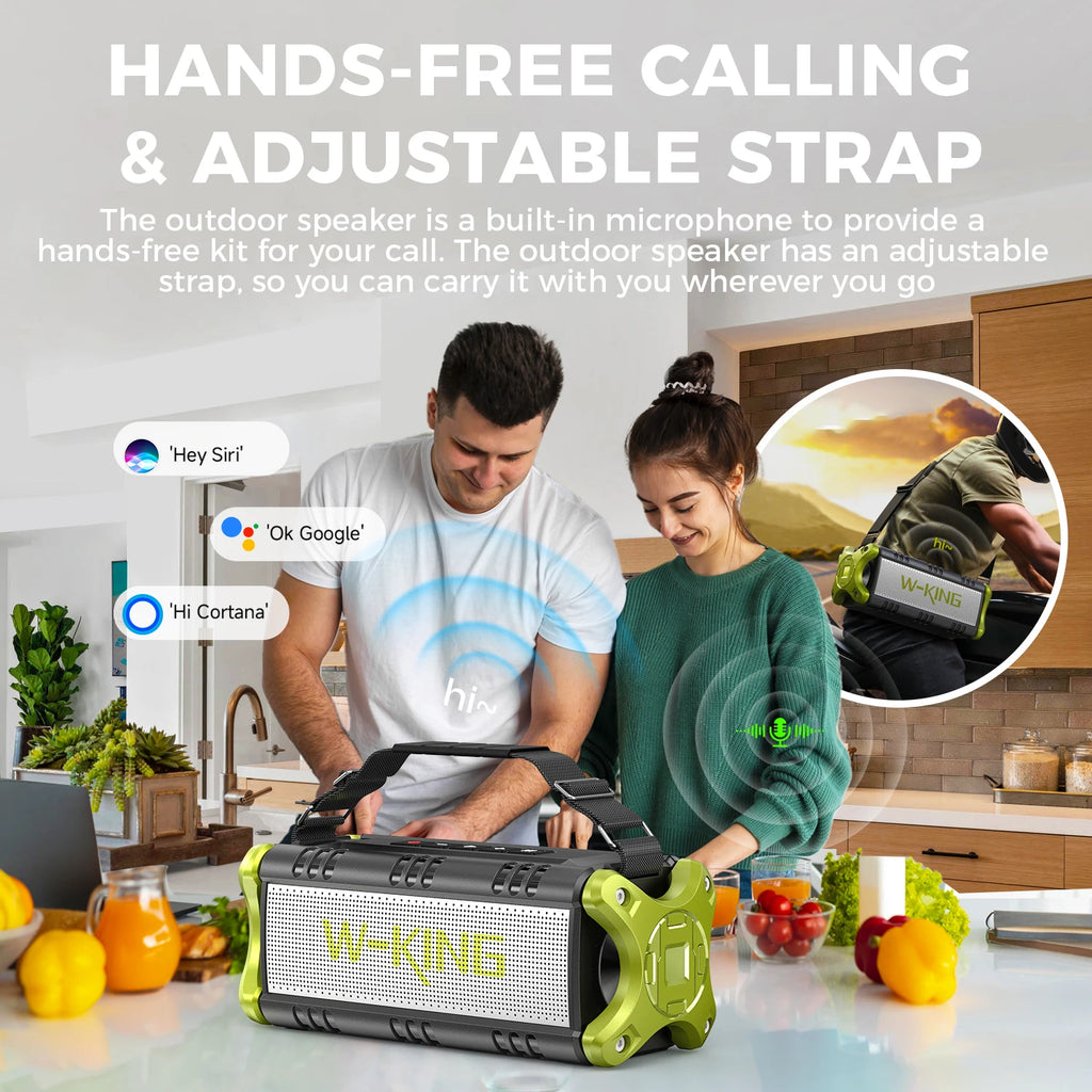 A couple using a portable, rugged olive green and black Bluetooth speaker with an adjustable carry strap in a kitchen.