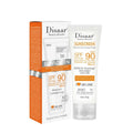 White and orange SPF 90 facial sunscreen tube and packaging box, offering moisturising UV protection and coverage.