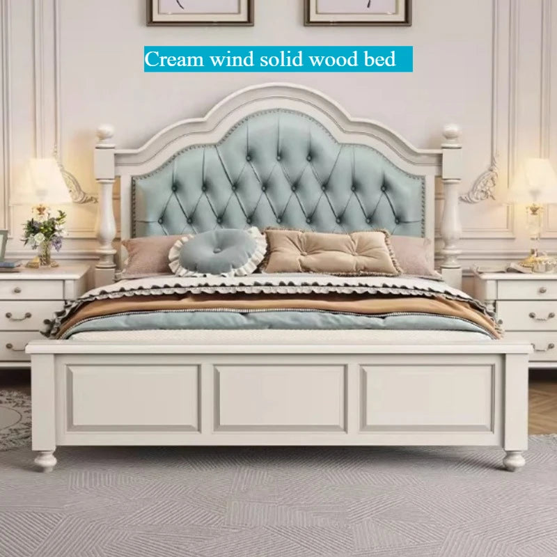 Cream-coloured solid wood double bed with an arched, button-tufted pale blue upholstered headboard.