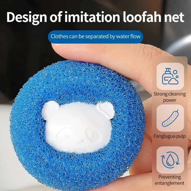 A hand holding a round, blue, textured laundry sponge with a cute white panda face in the centre.