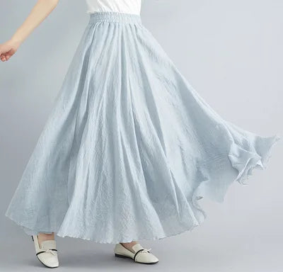 Flowing light blue maxi skirt with an elasticated waistband and textured, lightweight fabric.