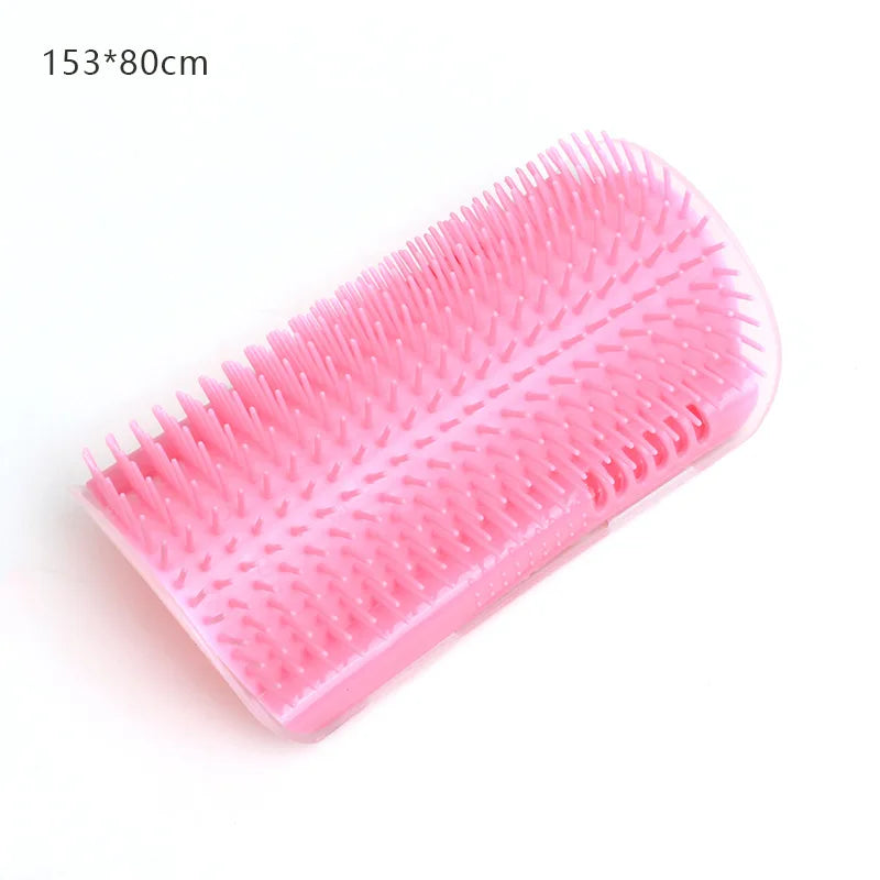 Pink plastic cat self-groomer brush, rectangular wall-mountable design with soft bristles, 153x80mm.