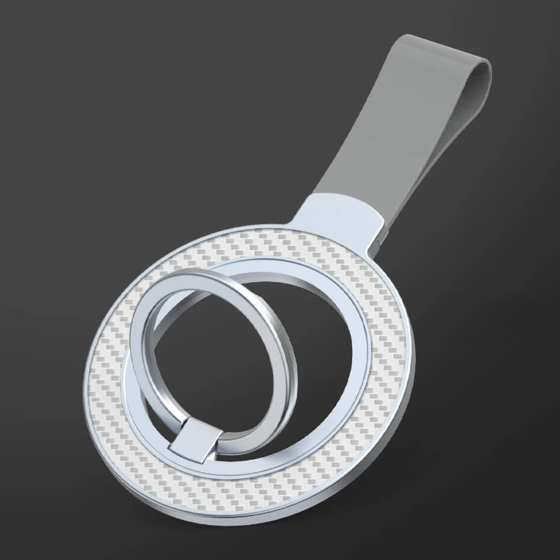 Silver phone ring holder with a carbon-fiber texture finish and a light gray wrist strap against a dark background.