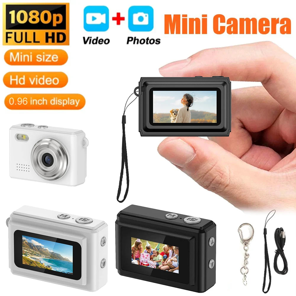 Small 1080p digital mini cameras in white and black plastic with a 0.96-inch display, lanyard, and key ring.