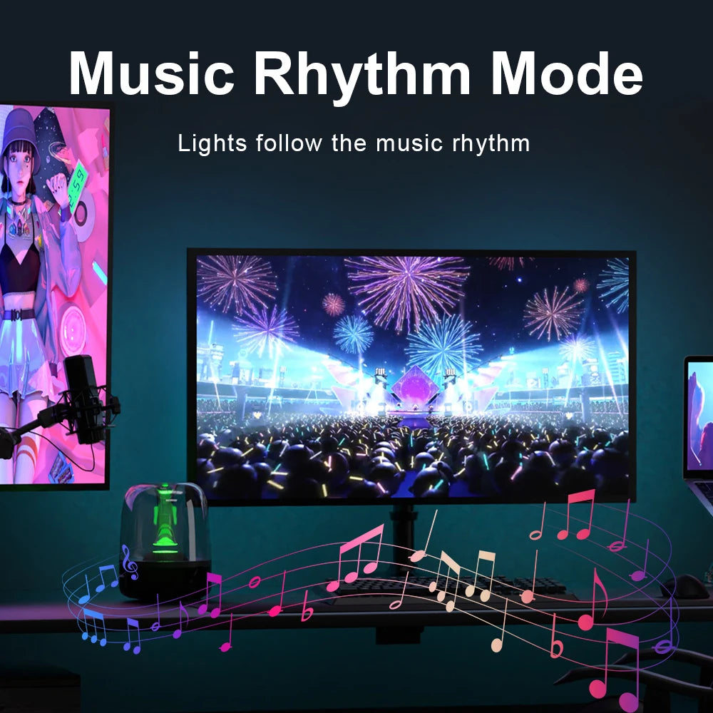 Multi-coloured LED monitor backlight strip glowing behind a computer screen, syncing with music beats.