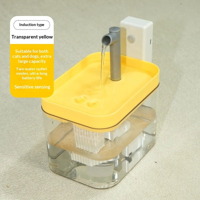 Transparent yellow automatic pet water fountain with a grey spout and sensor, featuring an internal filter system.