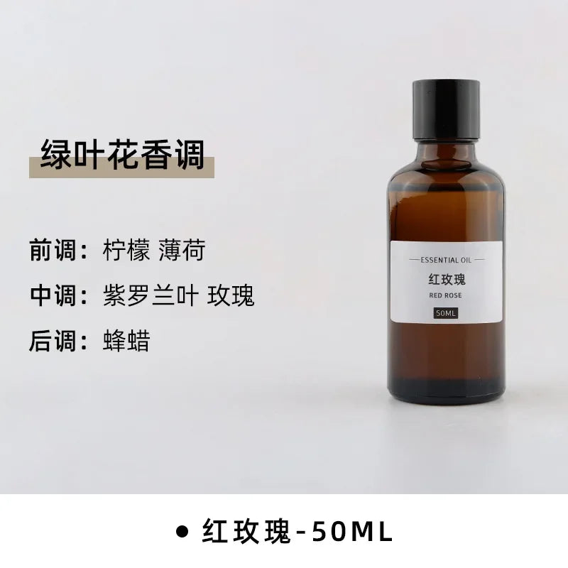 50ml amber glass bottle of Red Rose essential oil with black cap and minimalist white label.