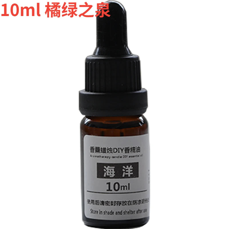 10ml amber glass essential oil bottle with a black dropper cap and white label for DIY candle making.