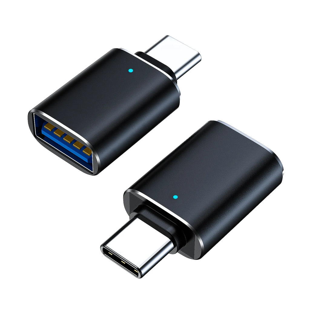 Two compact black USB-C to USB-A adapters with blue indicator lights, shown from different angles.