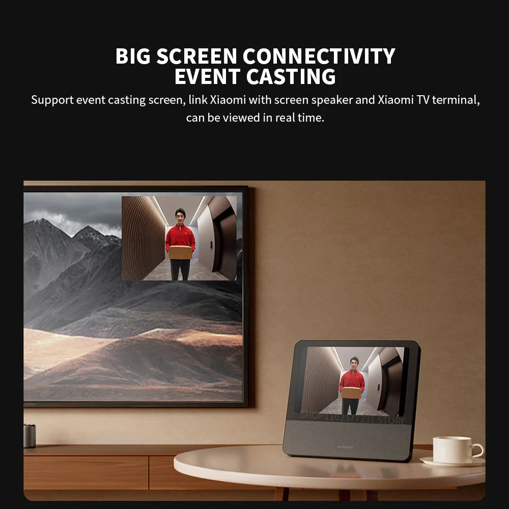 Smart doorbell with 5-inch screen casting live camera footage to a TV and desk display. Sleek black and grey design.