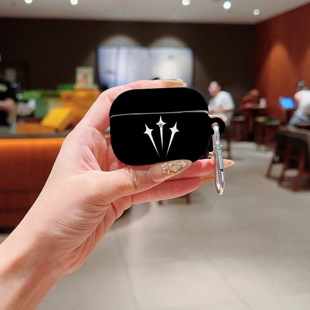 Black silicone case for AirPods Pro with a white star-shaped graphic and silver carabiner clip.