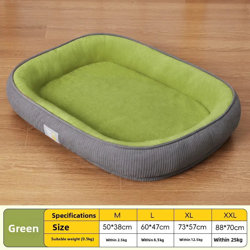 Rectangular green dog bed with a soft plush interior and ribbed dark gray outer walls on a wood floor.