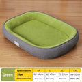 Rectangular green dog bed with a soft plush interior and ribbed dark gray outer walls on a wood floor.
