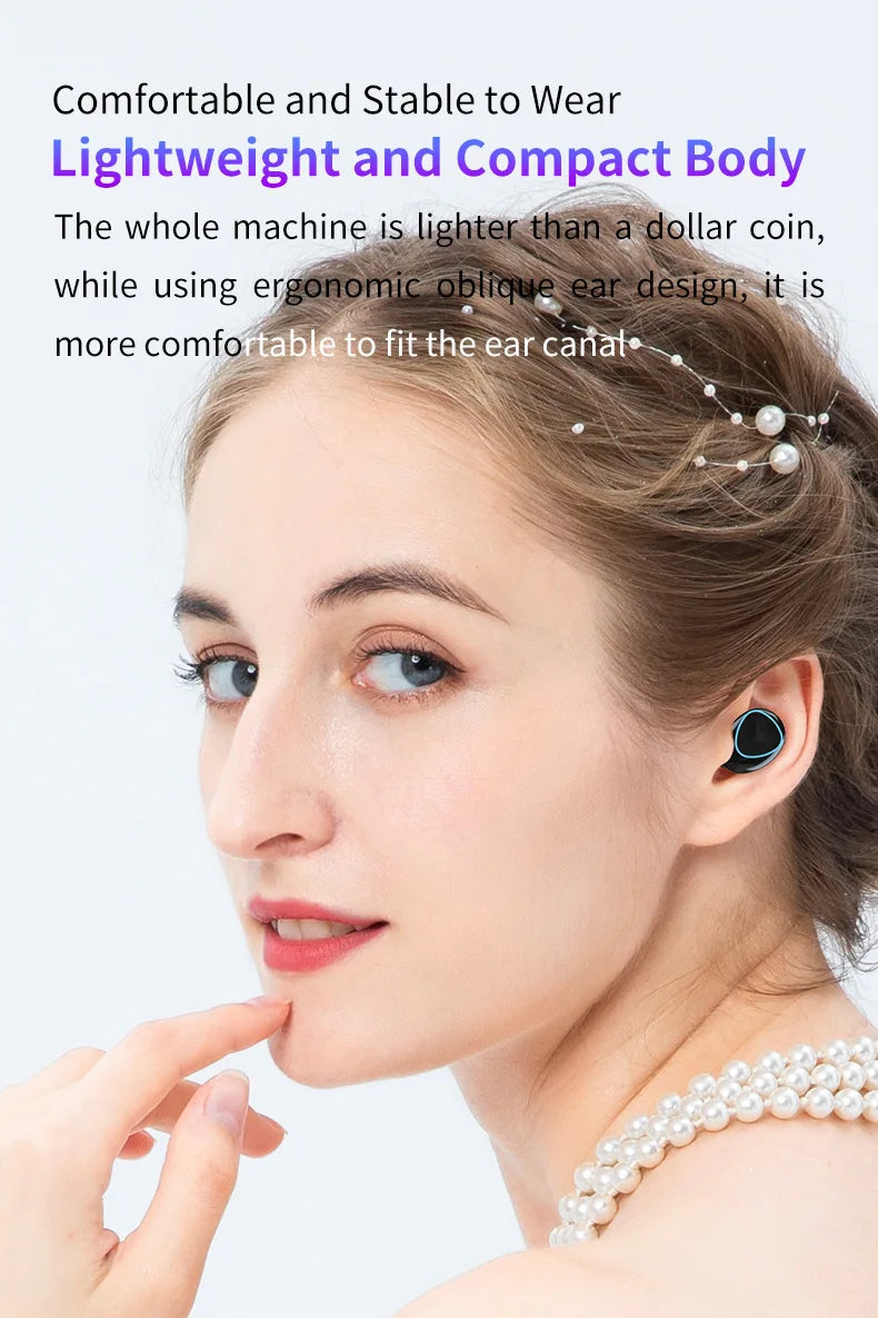 Woman wearing a small, ergonomic, black wireless earbud with a blue accent ring in her ear.