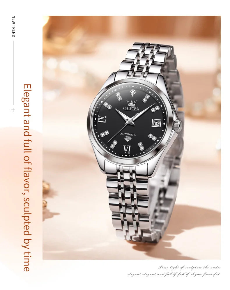 Elegant silver-tone stainless steel automatic watch with a black face, diamond hour markers and a date window.