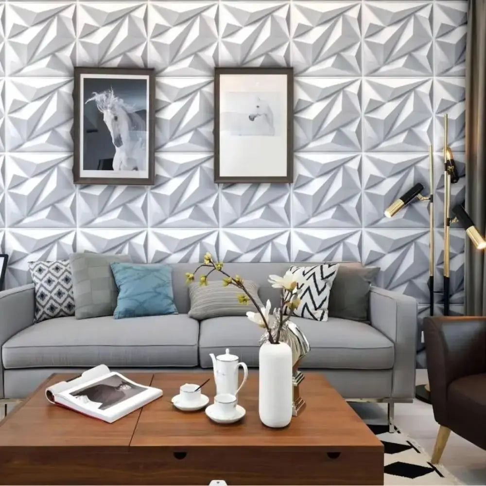 White 3D decorative wall tiles featuring a geometric diamond pattern in a modern living room setting.