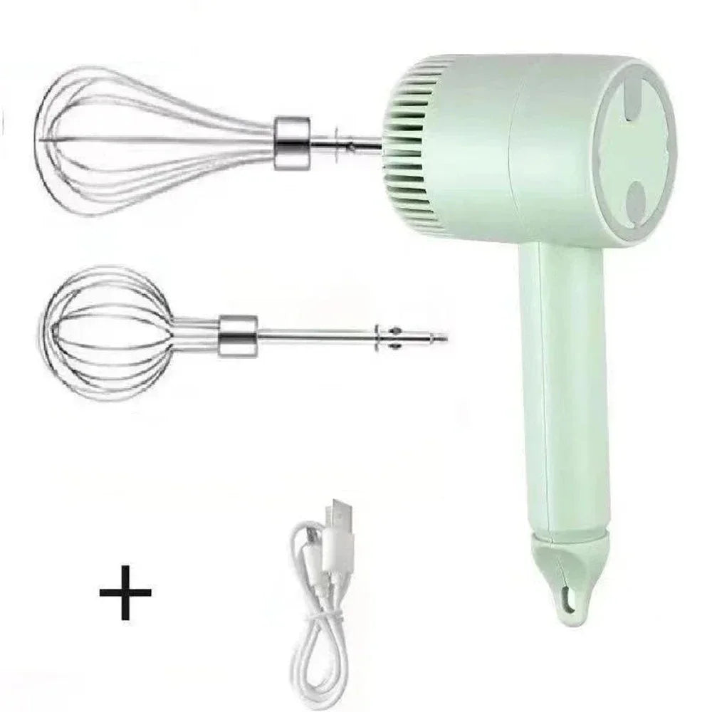 Pastel green handheld electric whisk with two stainless steel attachments and a USB charging cable.