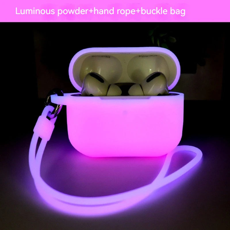 Glow-in-the-dark silicone AirPods Pro case in luminous pink, featuring a matching carry strap and metal buckle.